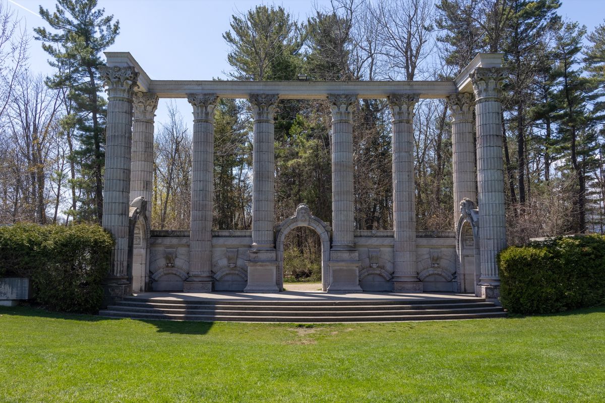 The Greek Theatre, a row of salvaged stone columns on a lawn at Guild Park and Gardens.